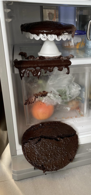 A spilled cake in a fridge