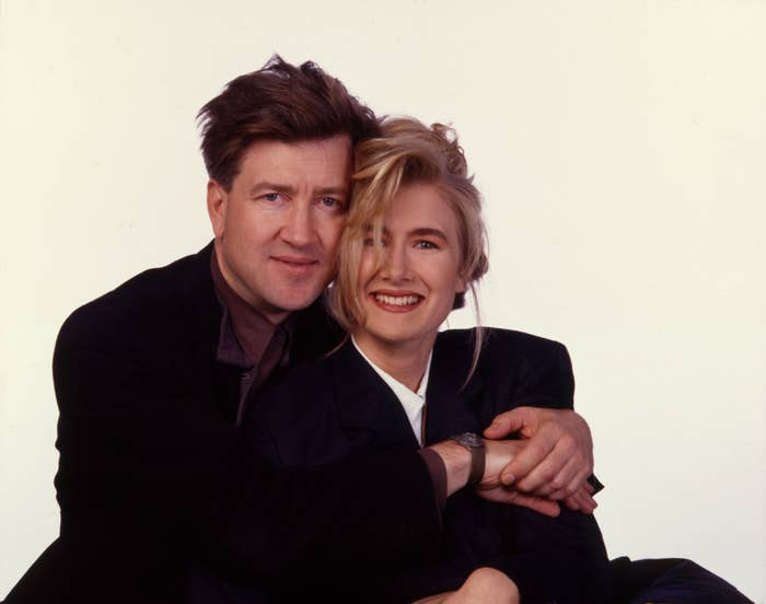 Picture of David Lynch hugging Laura Dern; both smile for the camera