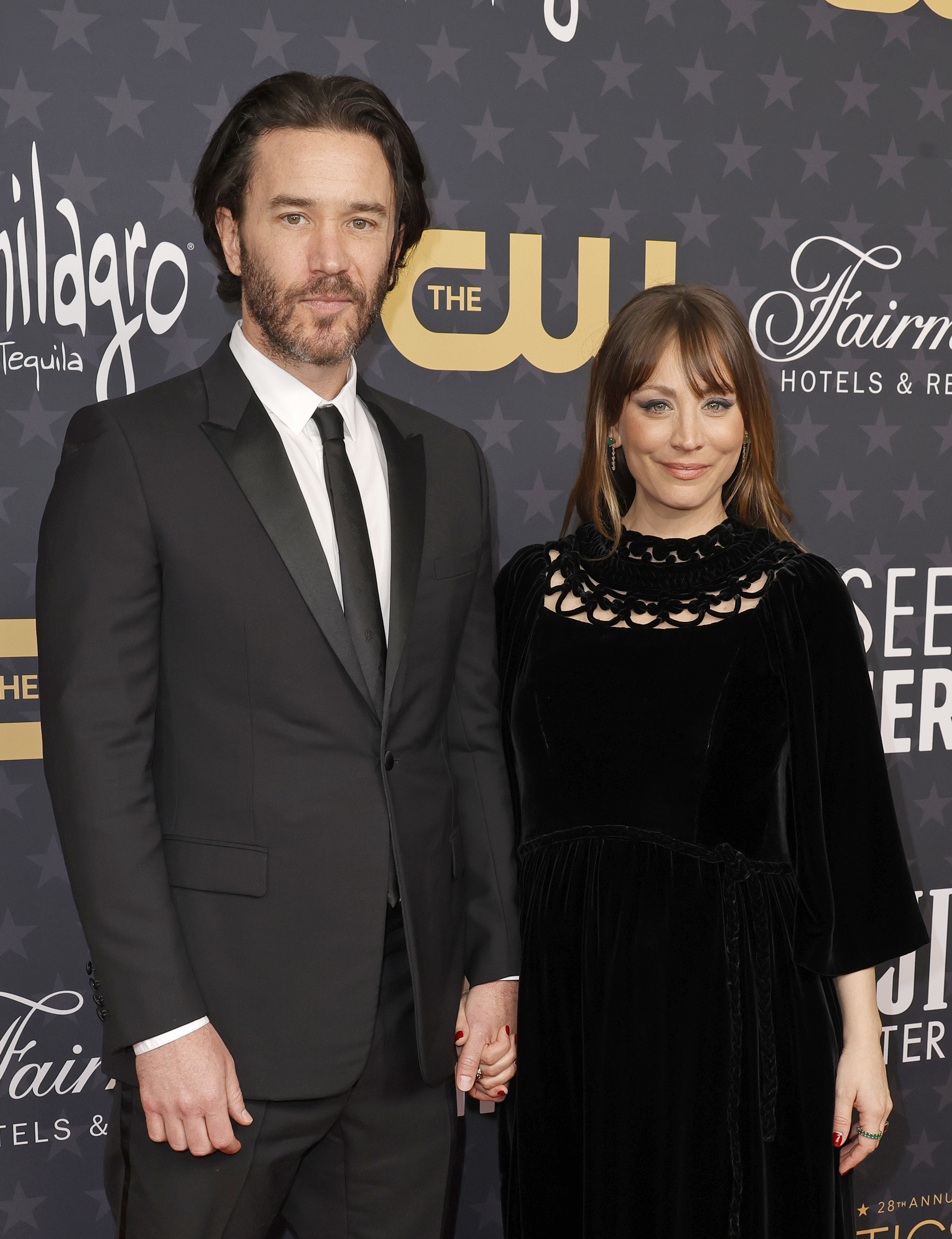 The couple holding hands at the critics choice awards