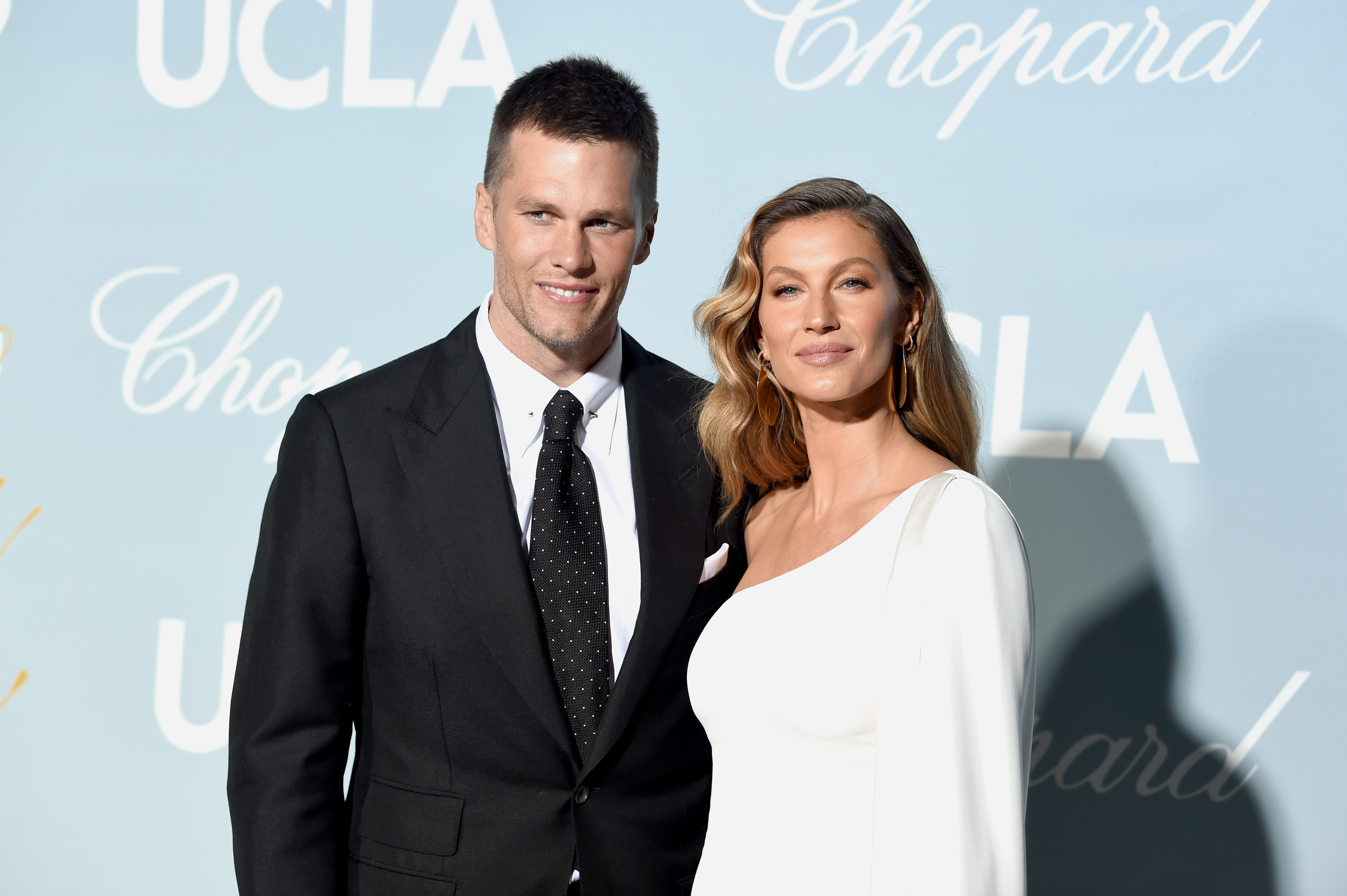 Close-up of Gisele and Tom at a media event