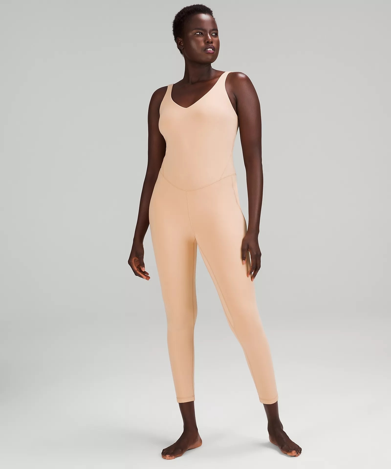 model wearing the cream colored bodysuit