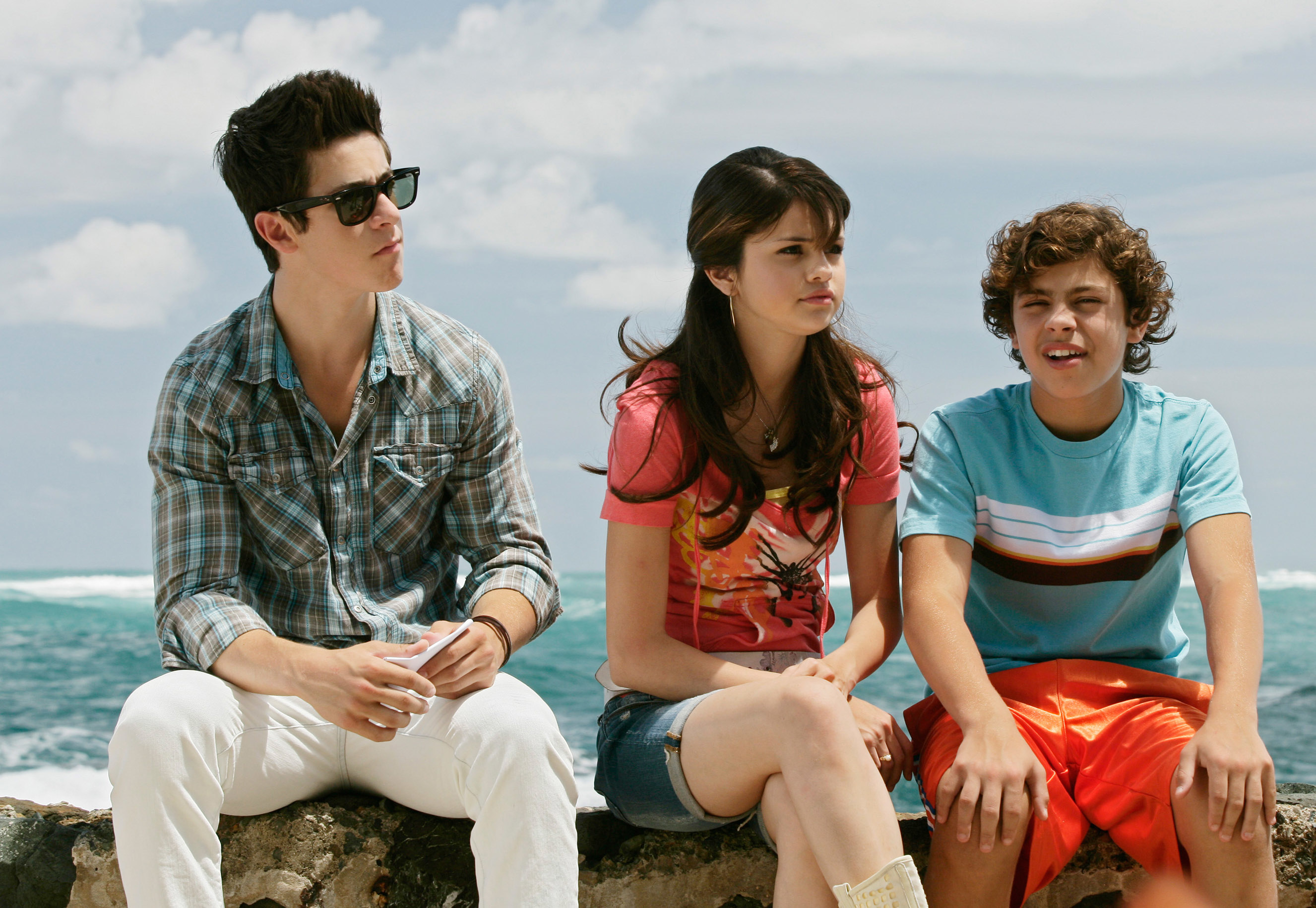 The Russo siblings sitting by the ocean in a scene from &quot;Wizards of Waverly Place: The Movie&quot;