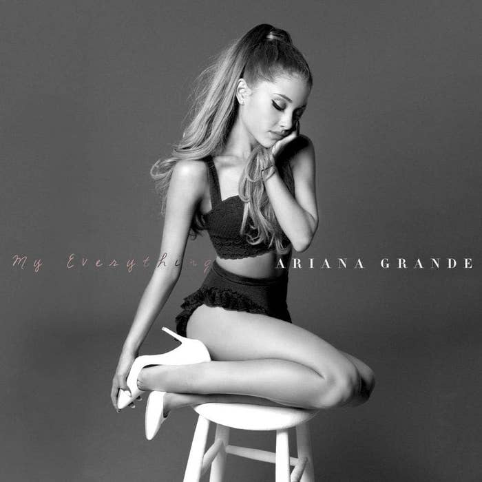 Ariana Grande sitting on a stool for &quot;My Everything&quot; album cover, wearing a black top and skirt.