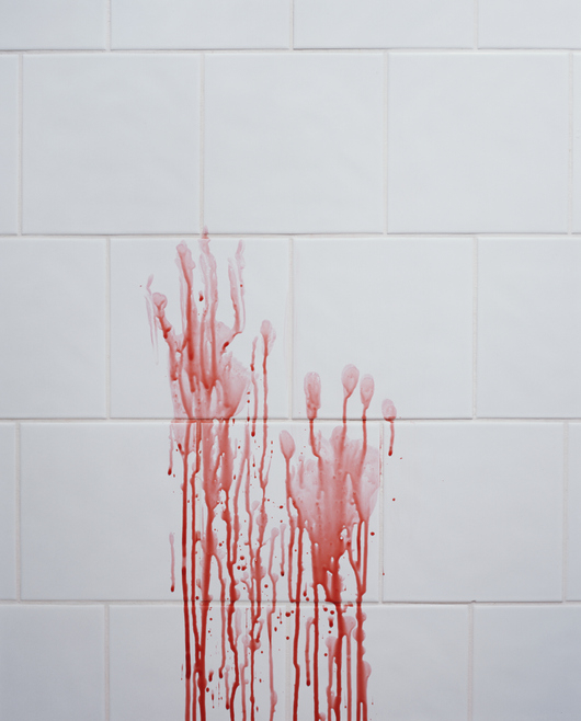 Bloody handprints on a wall