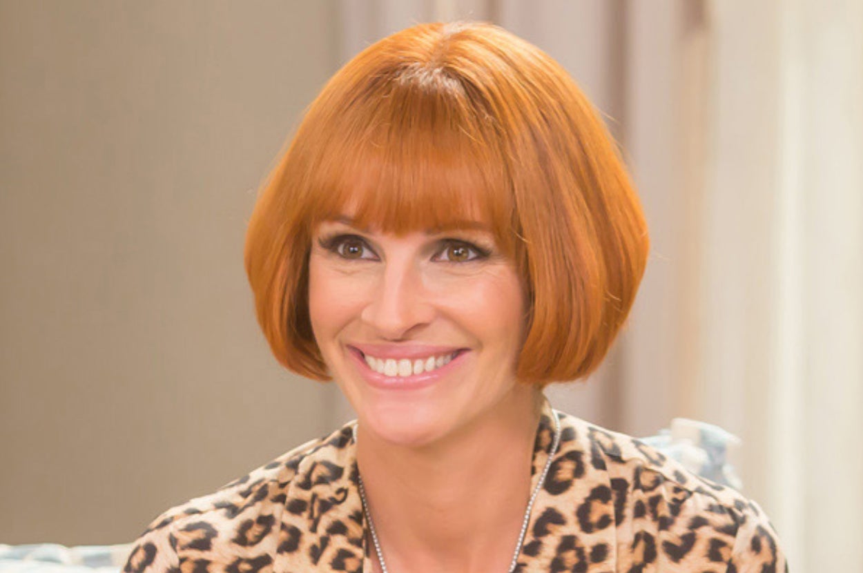 Julia Roberts smiling while wearing a short wig as Miranda in Mother's Day
