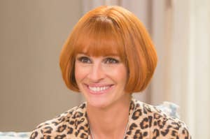 Julia Roberts smiling while wearing a short wig as Miranda in Mother's Day