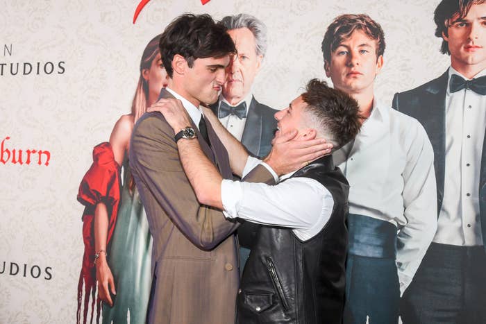 Jacob Elordi and Barry Keoghan playfully embracing each other on the red carpet