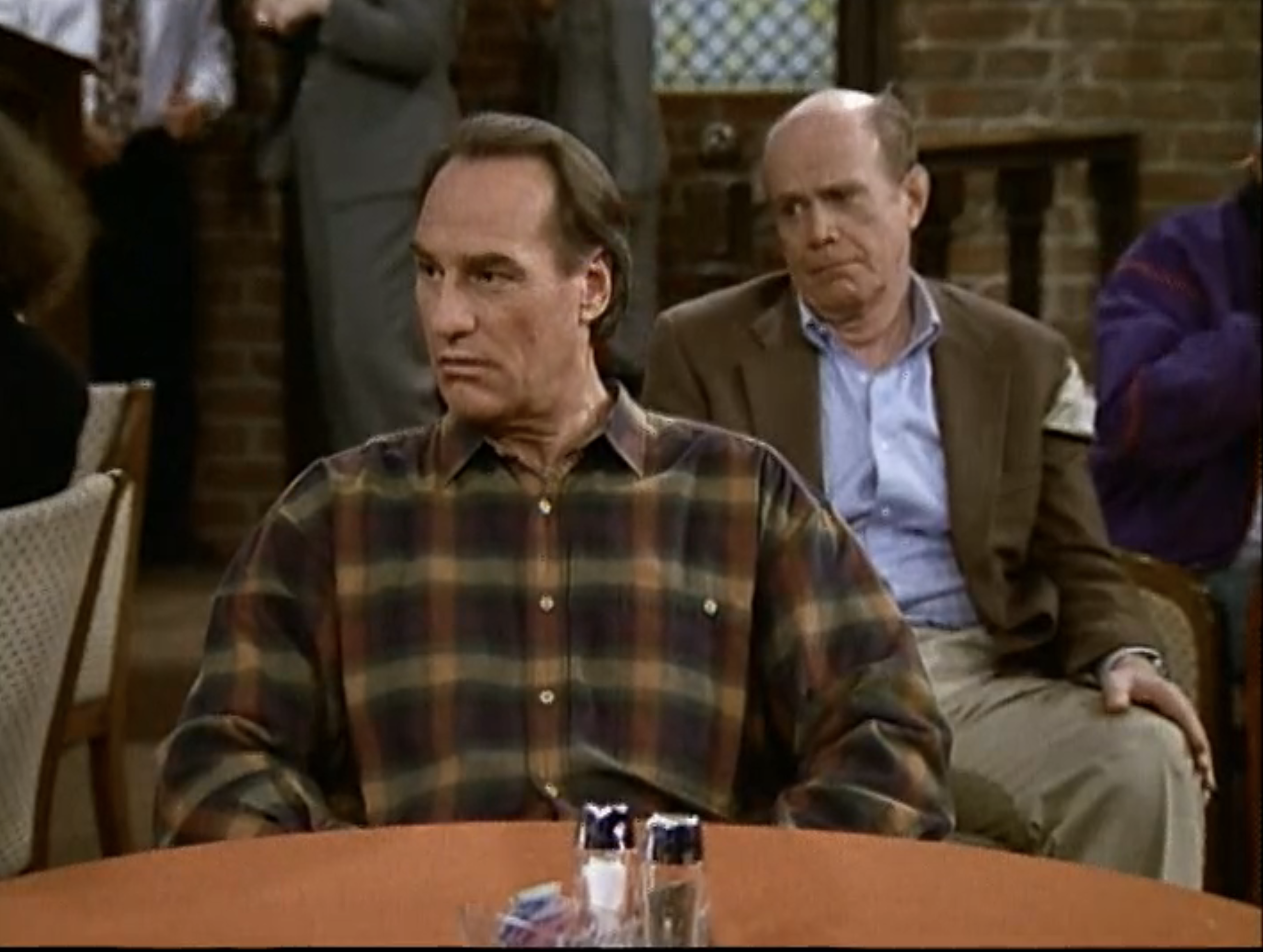 Craig T. Nelson sitting at a table