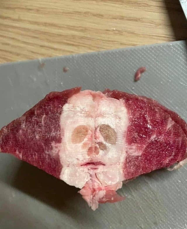it looks like a face is in the raw meat