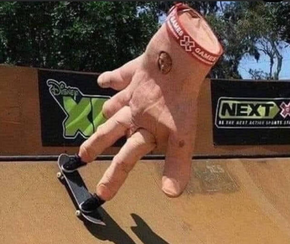 person wearing a hand suit skateboarding