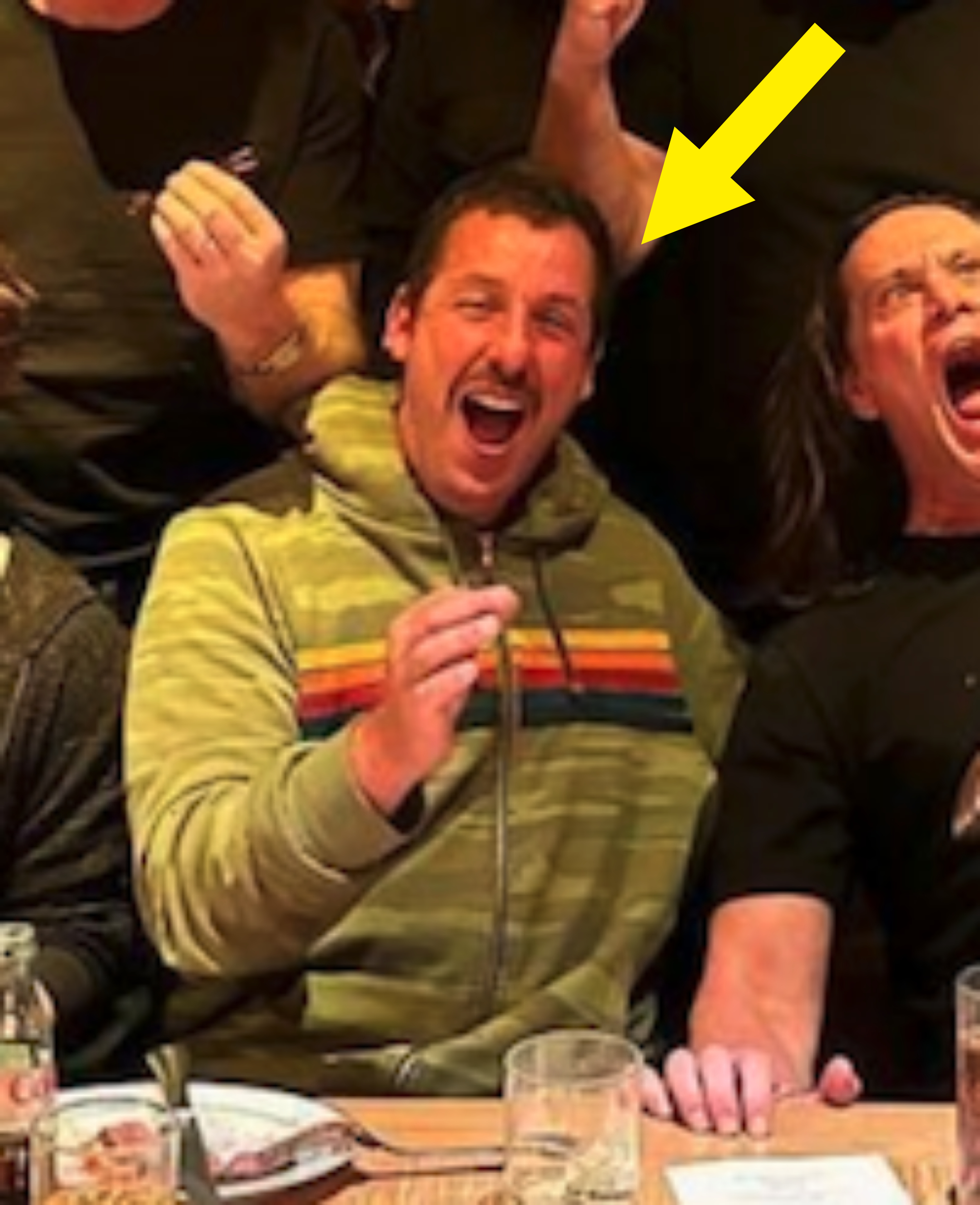 Arrow pointing to Adam laughing