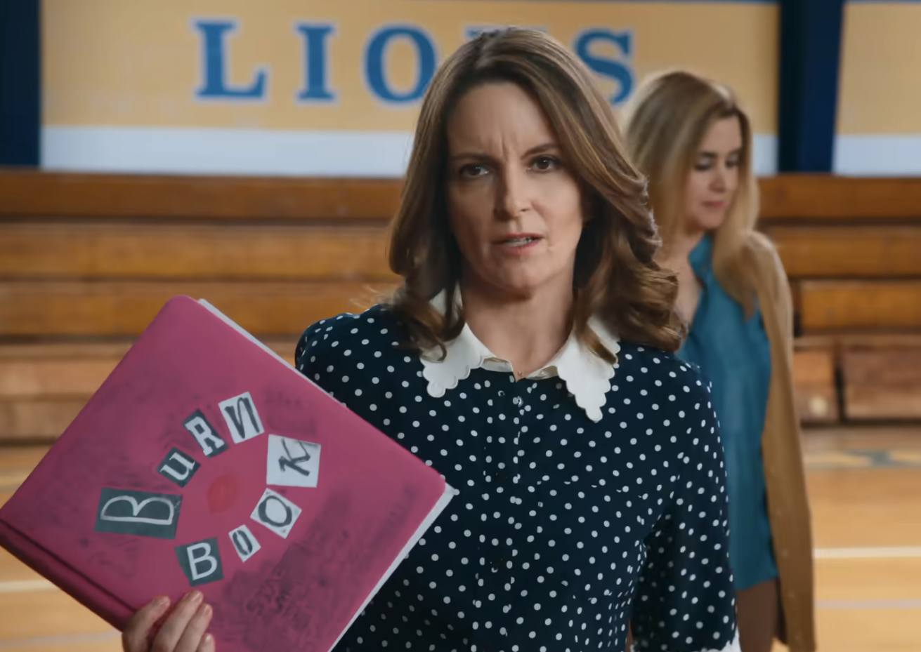 tina holding the burn book in a the gym