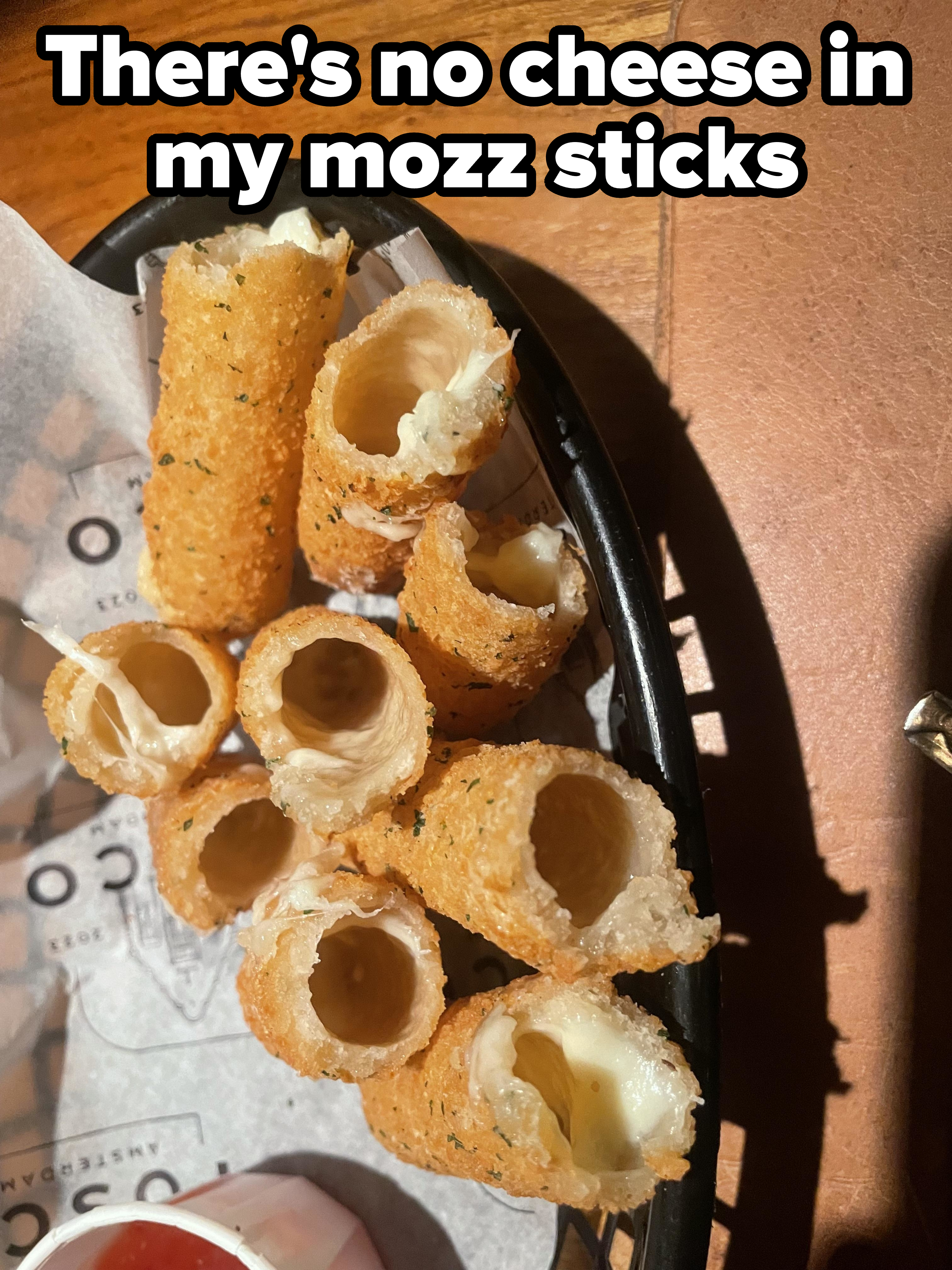 &quot;There&#x27;s no cheese in my mozz sticks.&quot; showing mozzarella sticks with little or no cheese inside