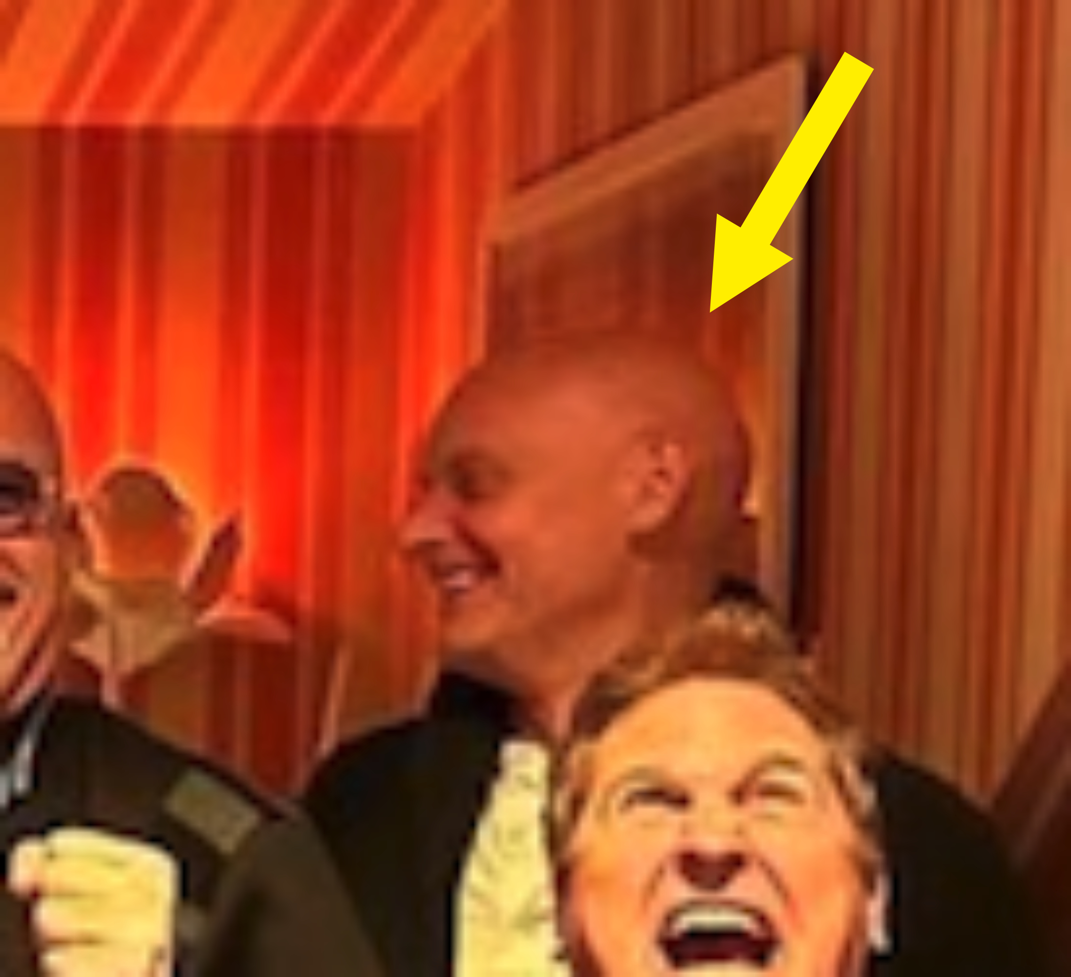 Arrow pointing to Paul smiling