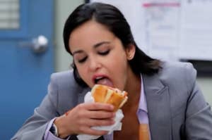Amy from Brooklyn Nine Nine eating a sandwich
