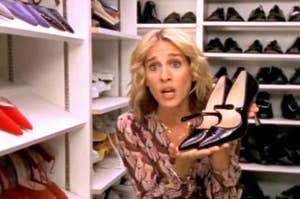 Carrie holding a pair of shoes.