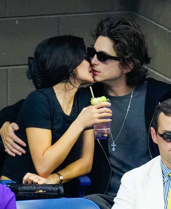 the two kissing at a sports event