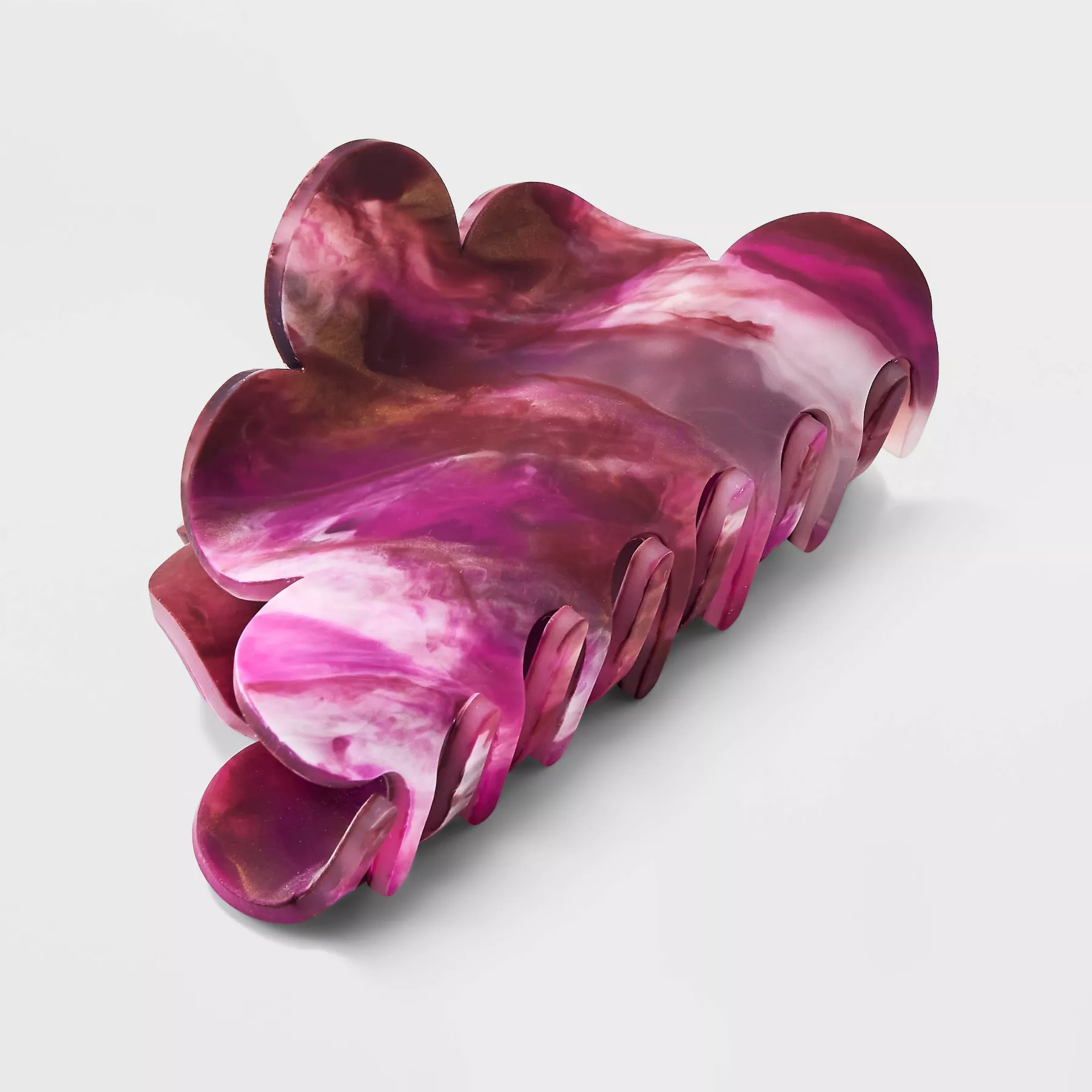 The Hair Clip in a dark pink marble color