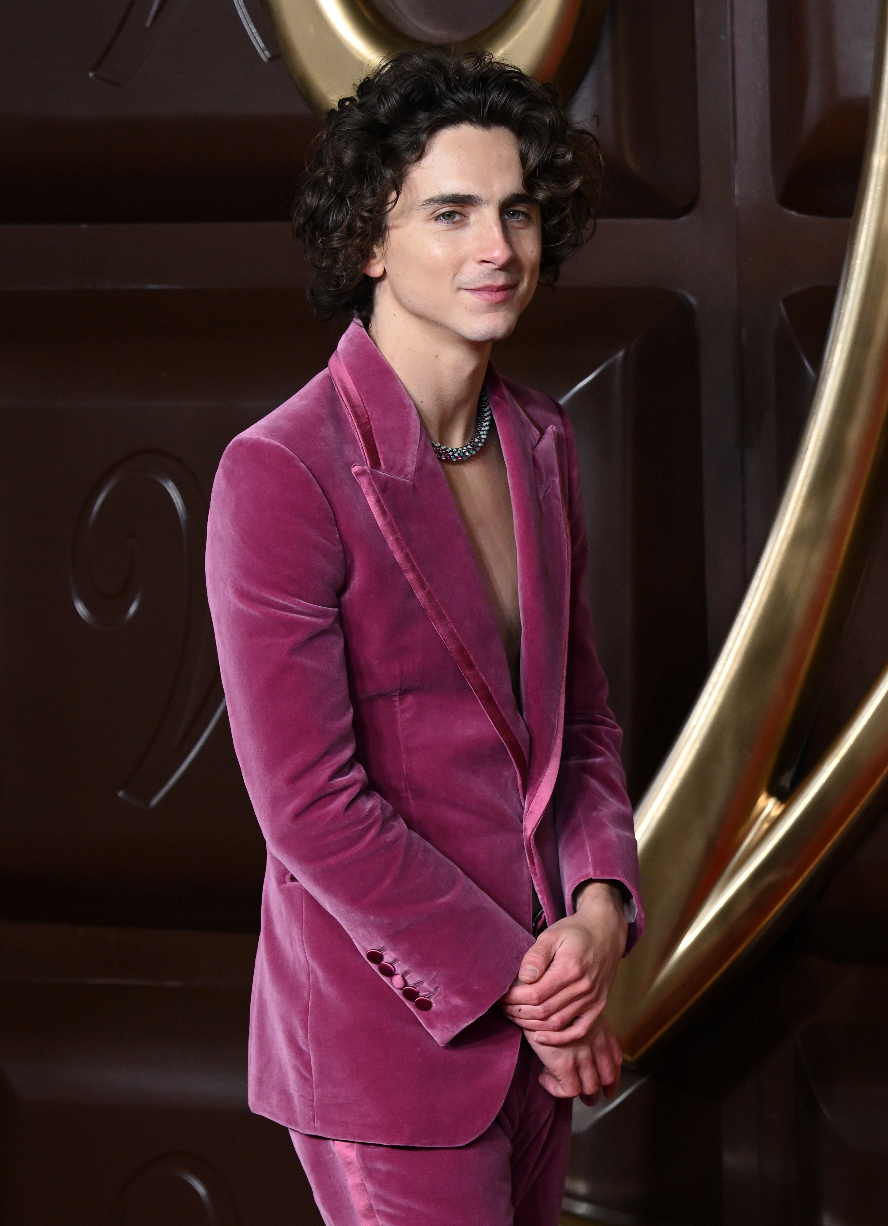 closeup of him in a velvet suit