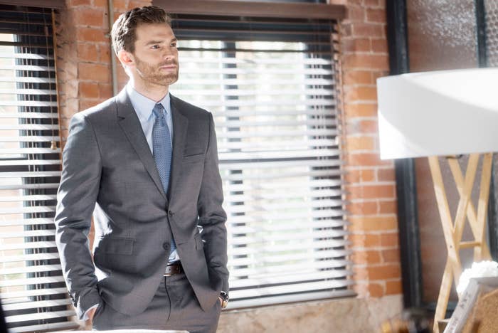 Jamie wearing a suit in a scene from &quot;Fifty Shades of Grey&quot;