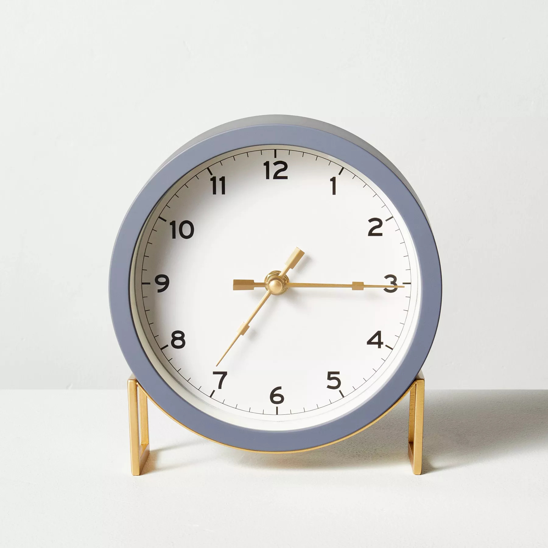 The round clock in gray and brass