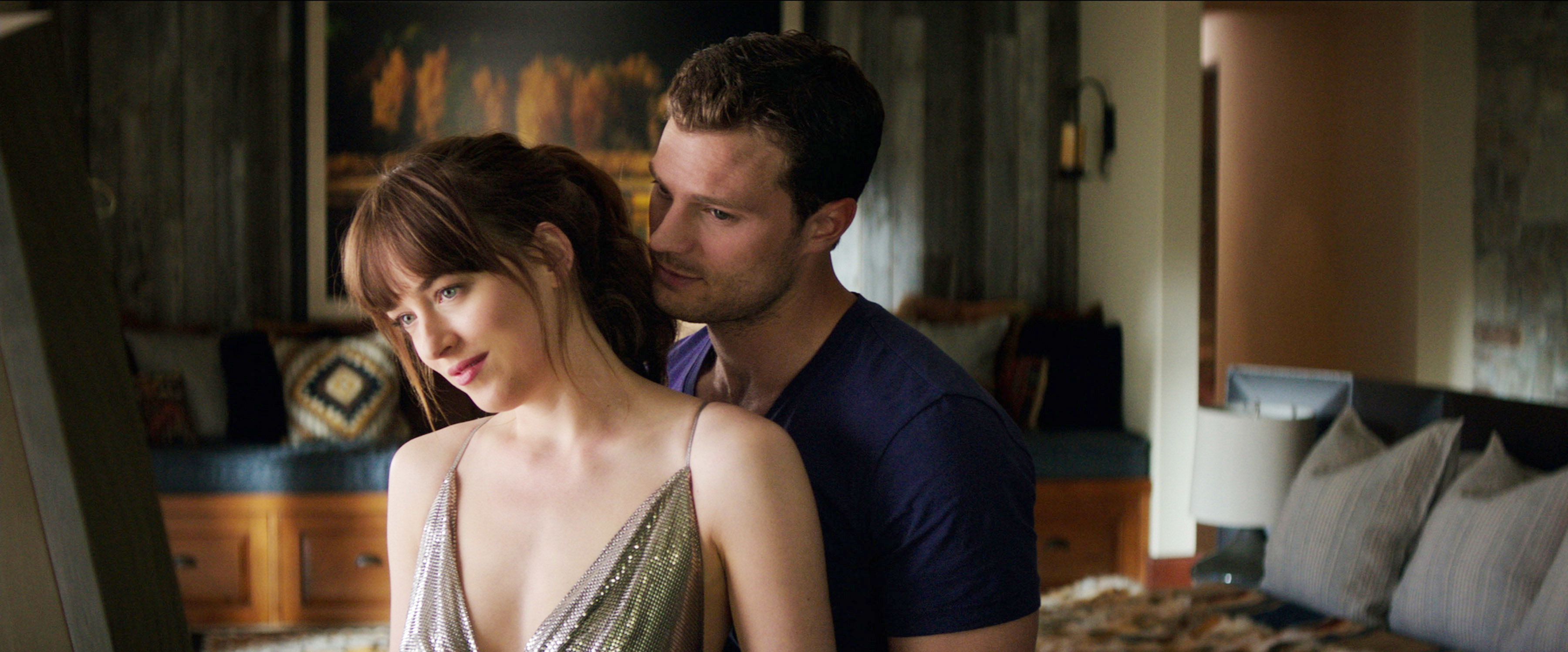 Jamie holding Dakota from behind in a scene from &quot;Fifty Shades of Grey&quot;