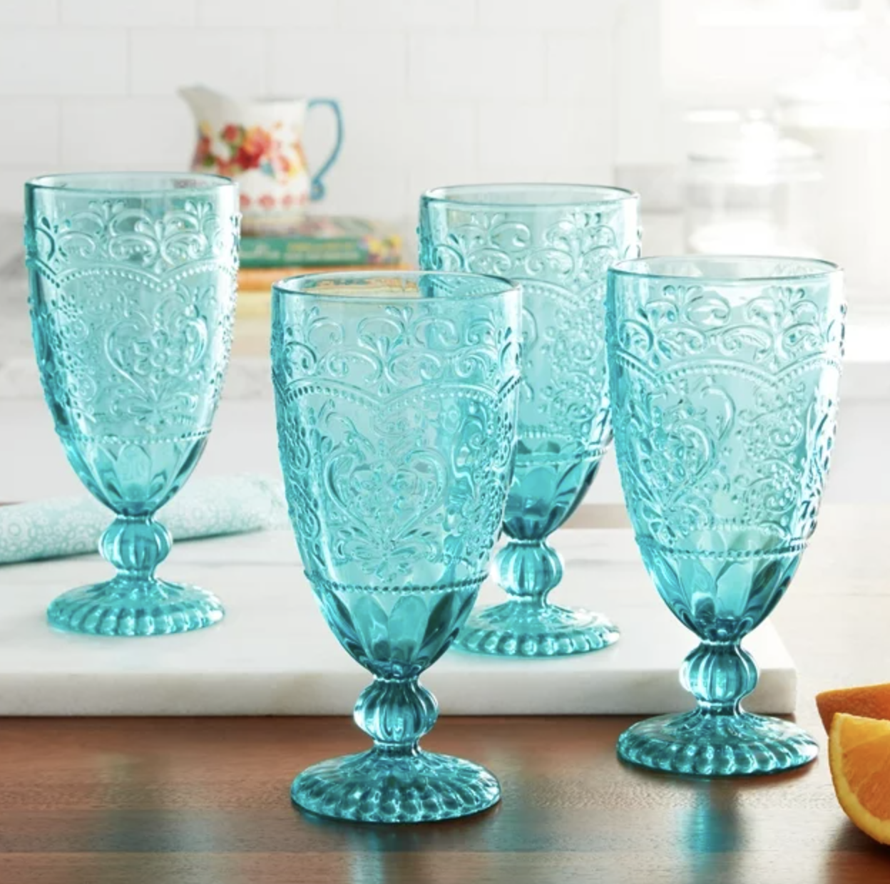 four blue goblets on table