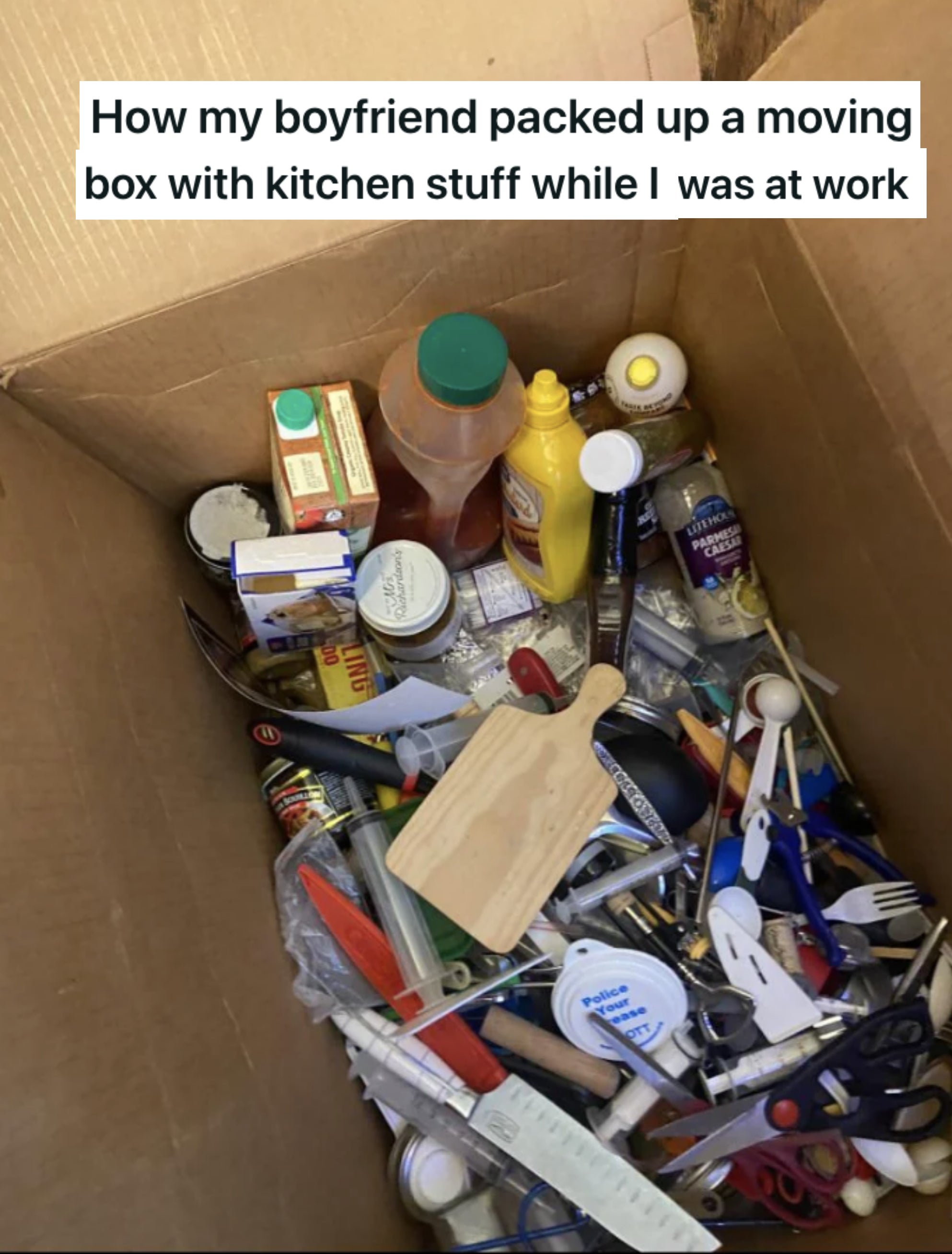 a box with a bunch of kitchen stuff in it