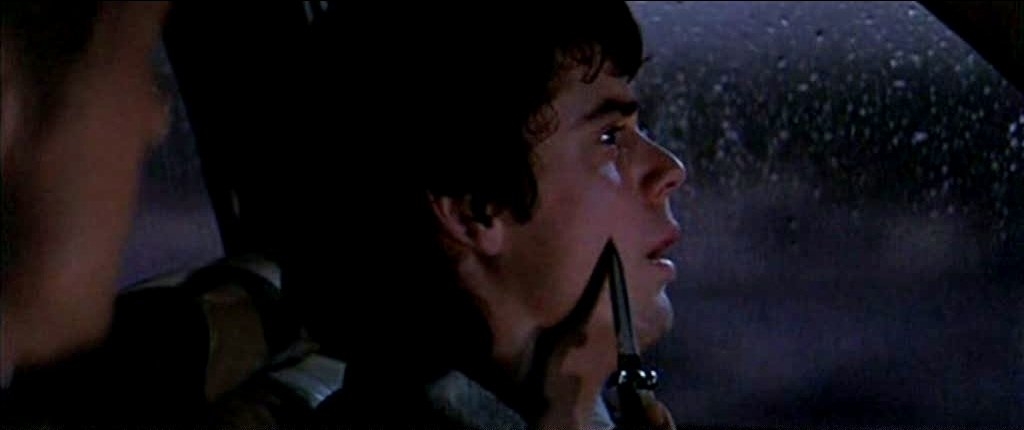 C. Thomas Howell being threatened with a knife.