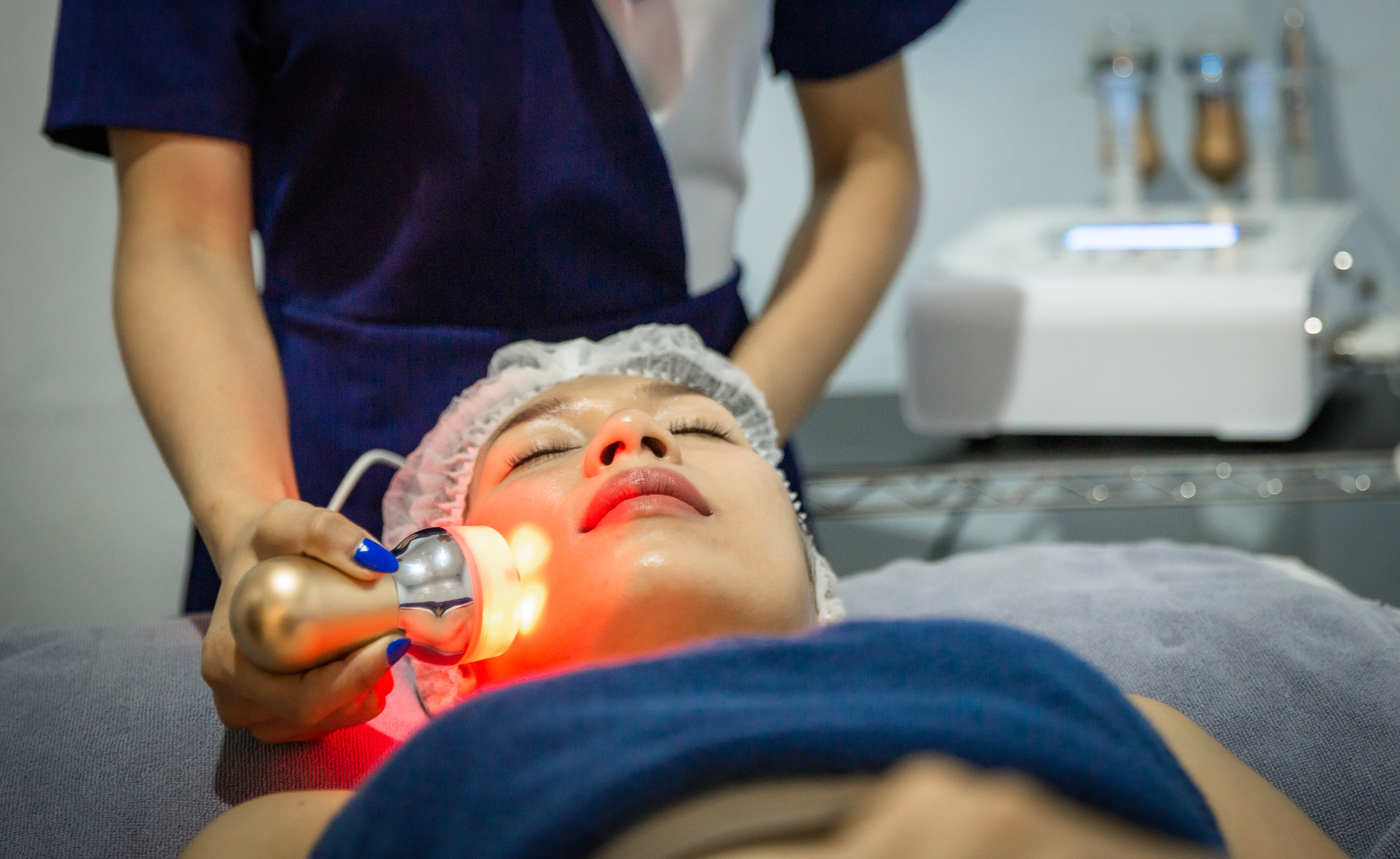 woman getting a laser treatment on her face
