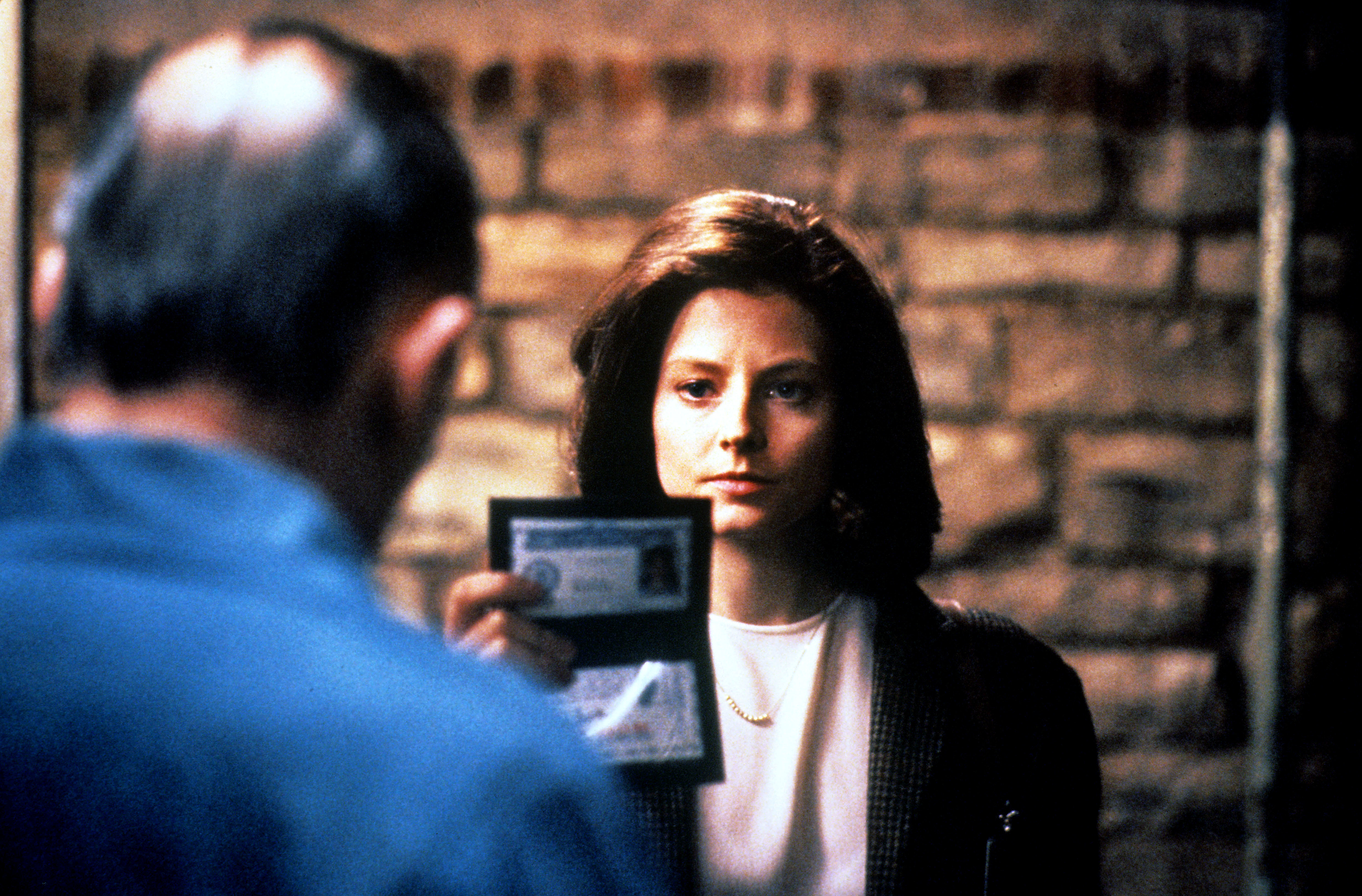 Jodie holding up her FBI badge in a scene from &quot;The Silence of the Lambs&quot;