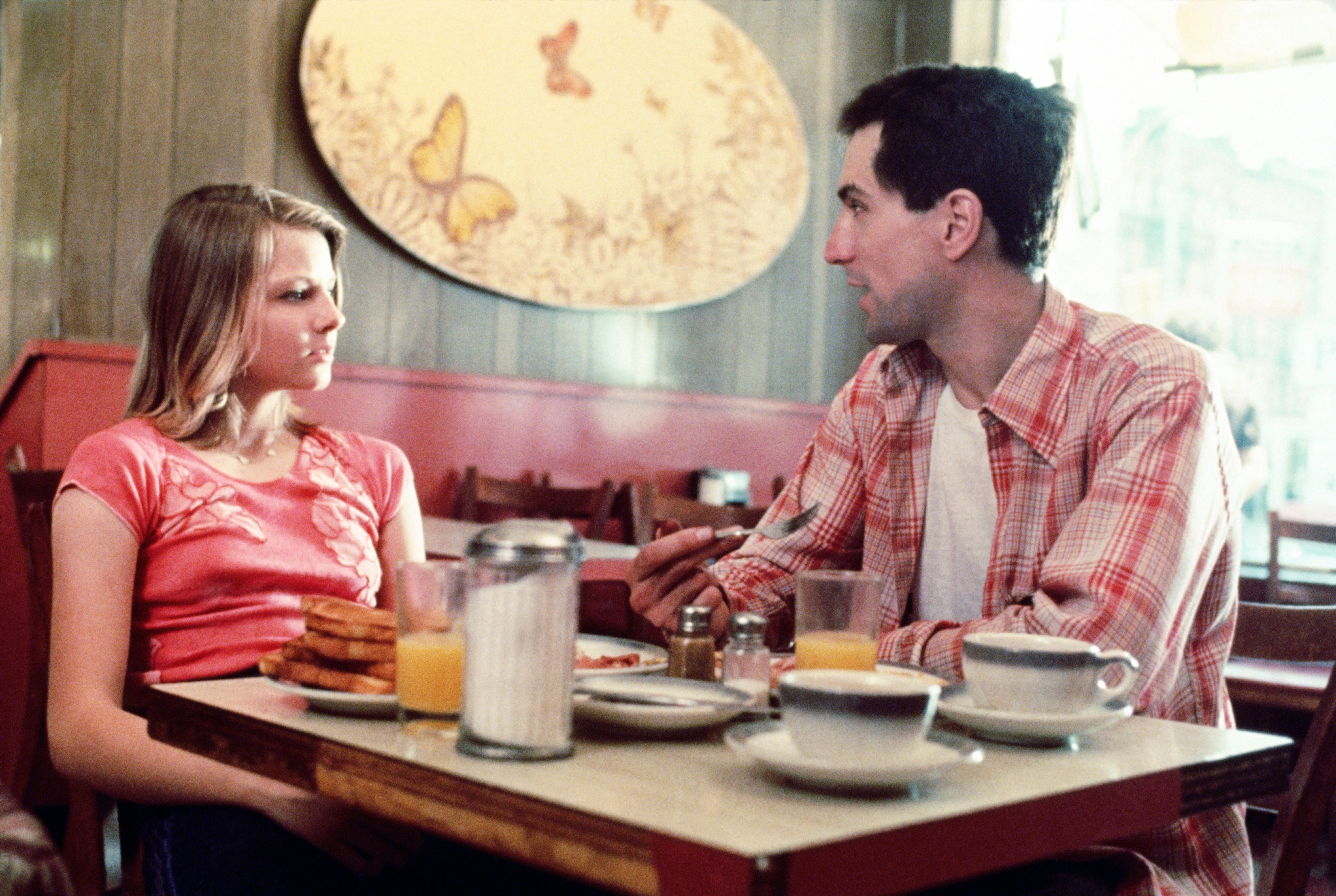 Jodie sitting at a diner with Robert De Niro in a scene from &quot;Taxi Driver&quot;
