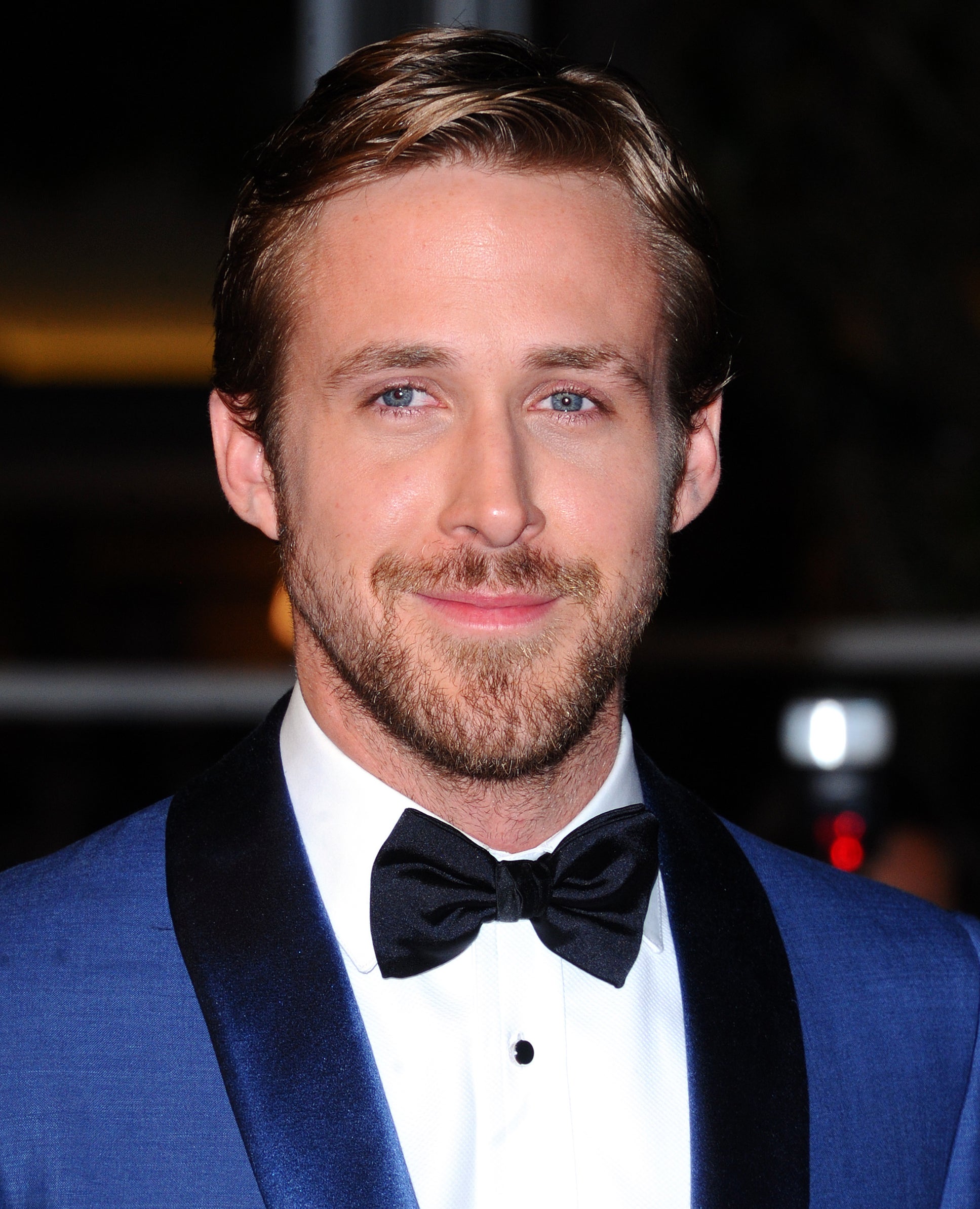 A close-up of Ryan wearing a suit and bow tie
