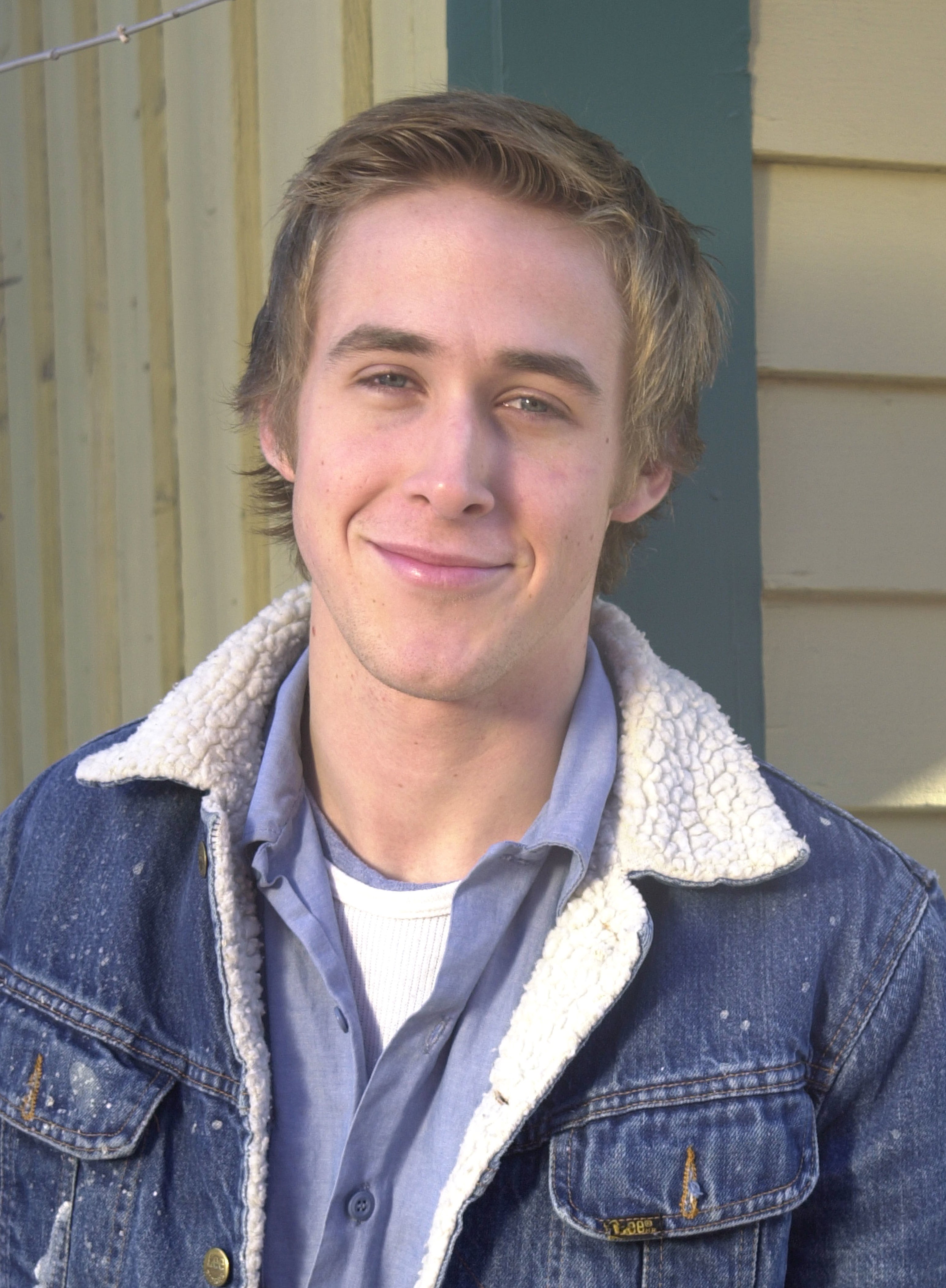 Close-up of a younger Ryan in a denim jacket and shirt