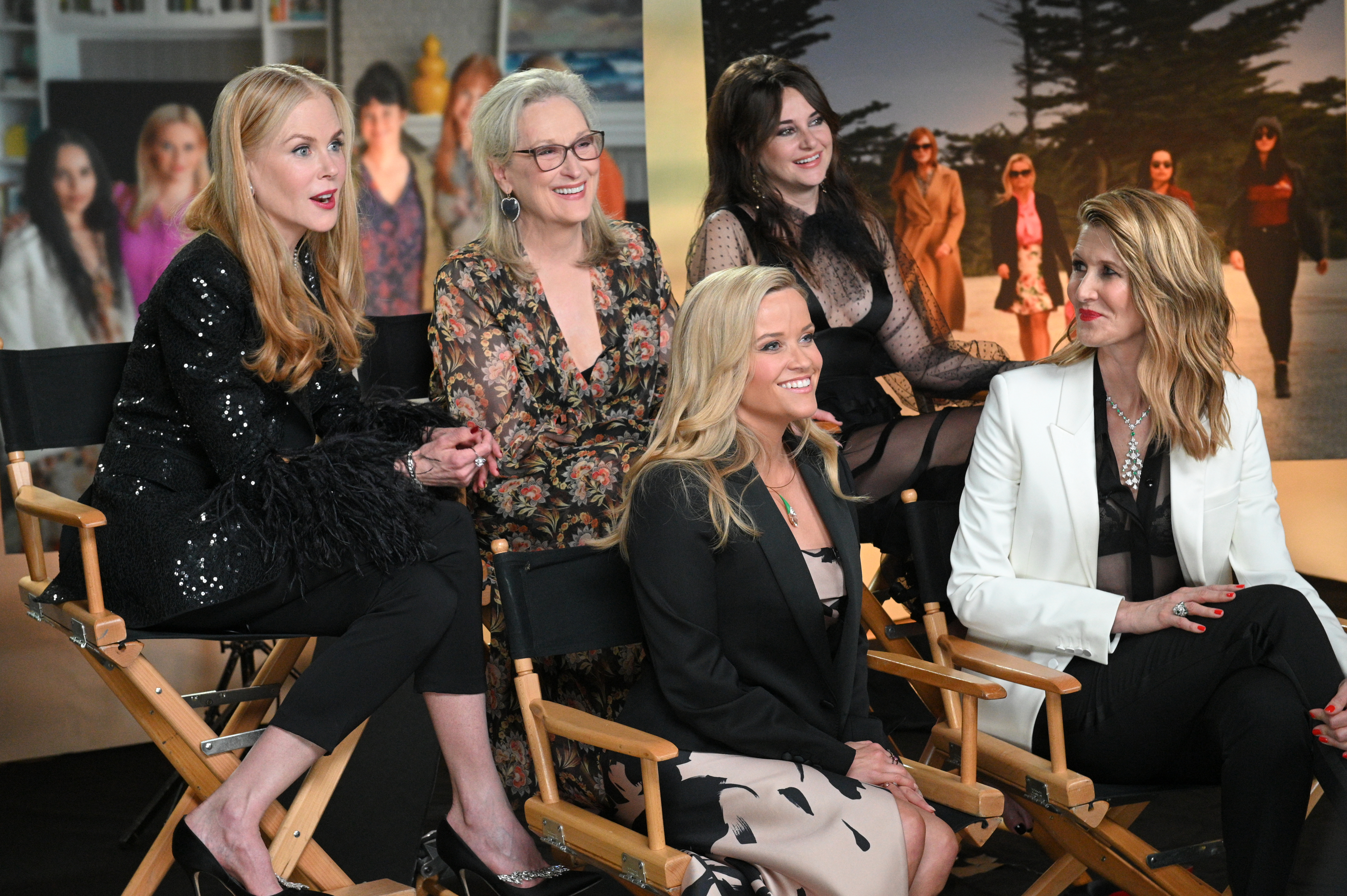 Four of the costars, plus Meryl, sitting together and smiling