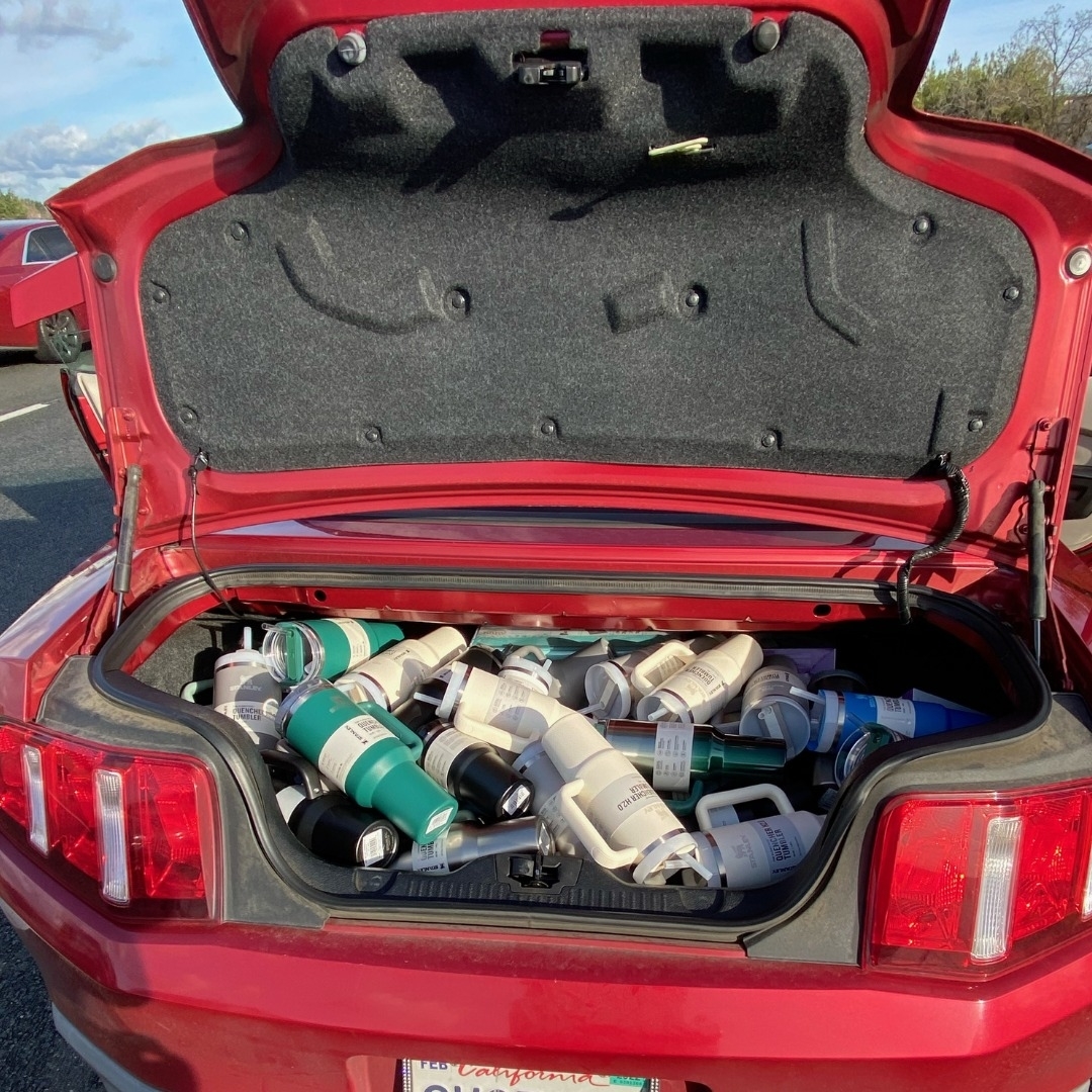 Stanley cups in a car trunk