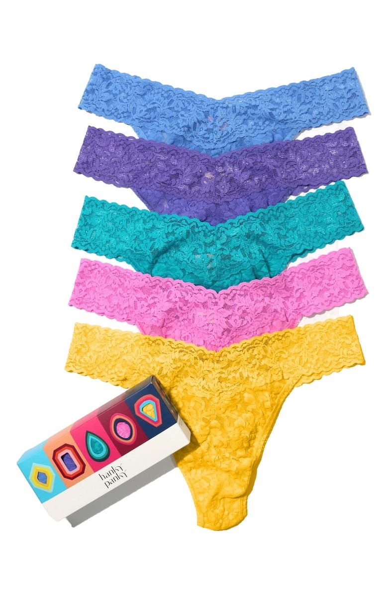 a five pack of lace thongs in a gem-stone themed box