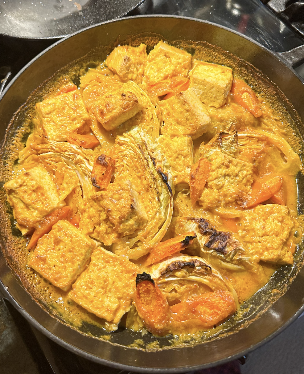 Cabbage tofu and carrots in a curry sauce after baking