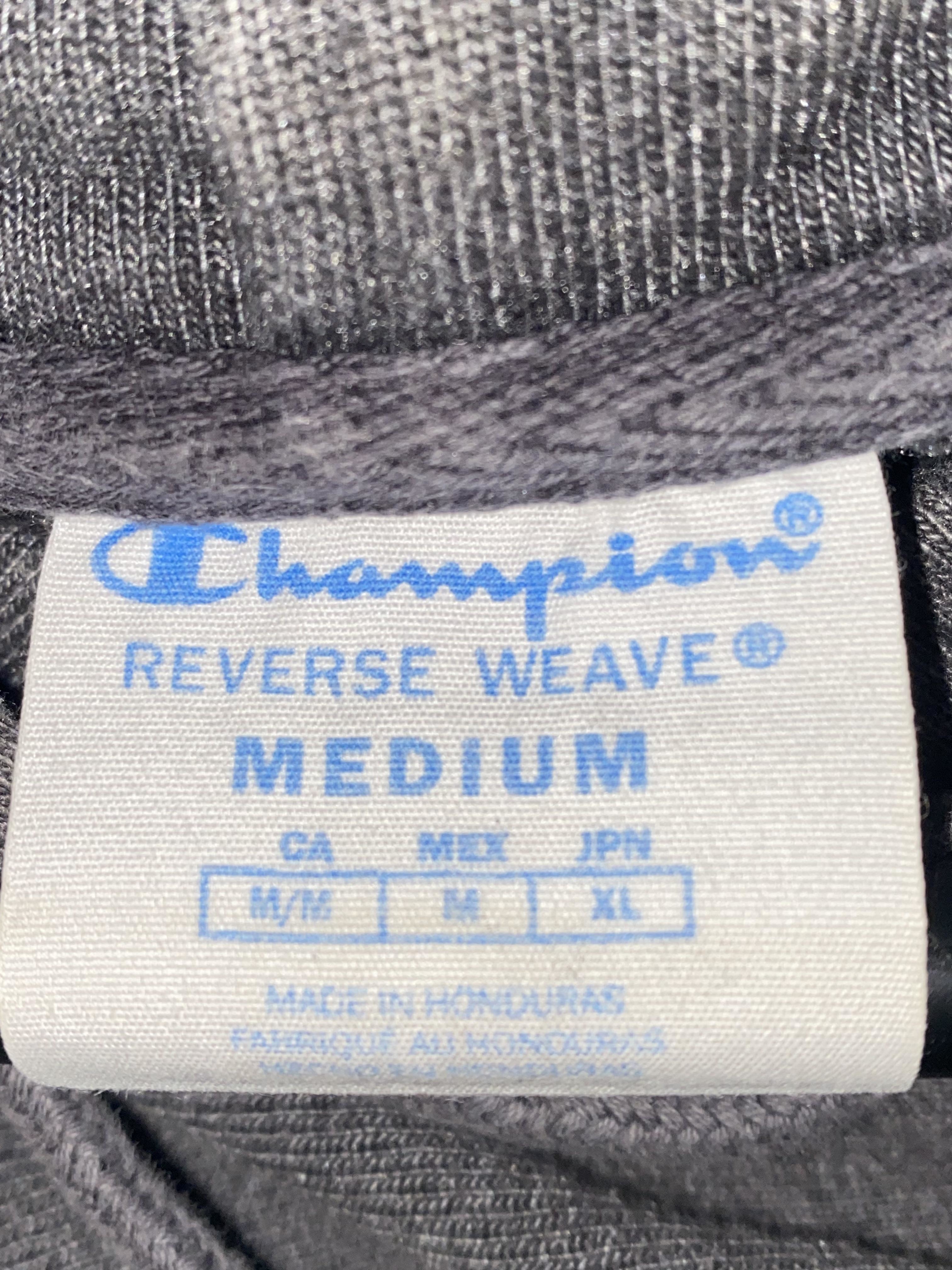 Label of a medium Champion shirt showing it&#x27;s M/M in Canada, M in Mexico, and XL in Japan