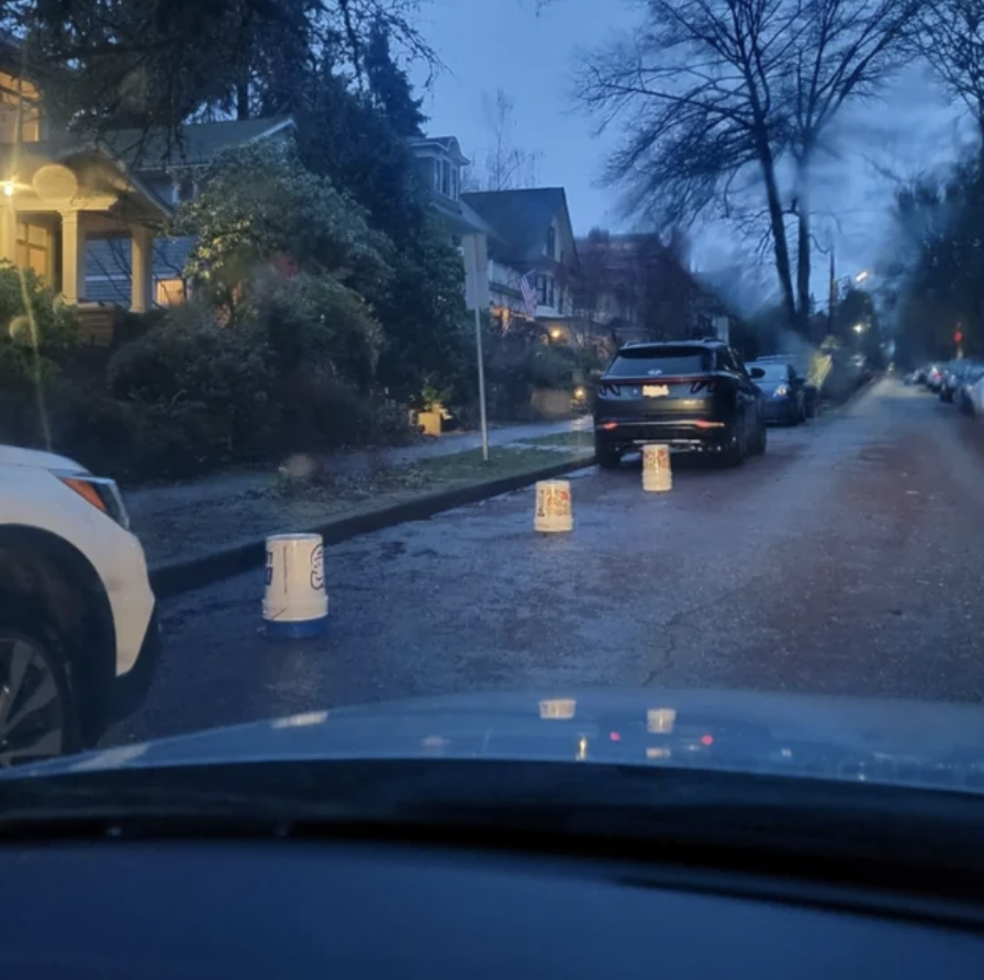 Buckets blocking people from parking on the street