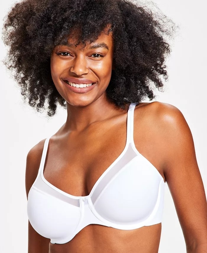 a model posing in the white u-shaped bra