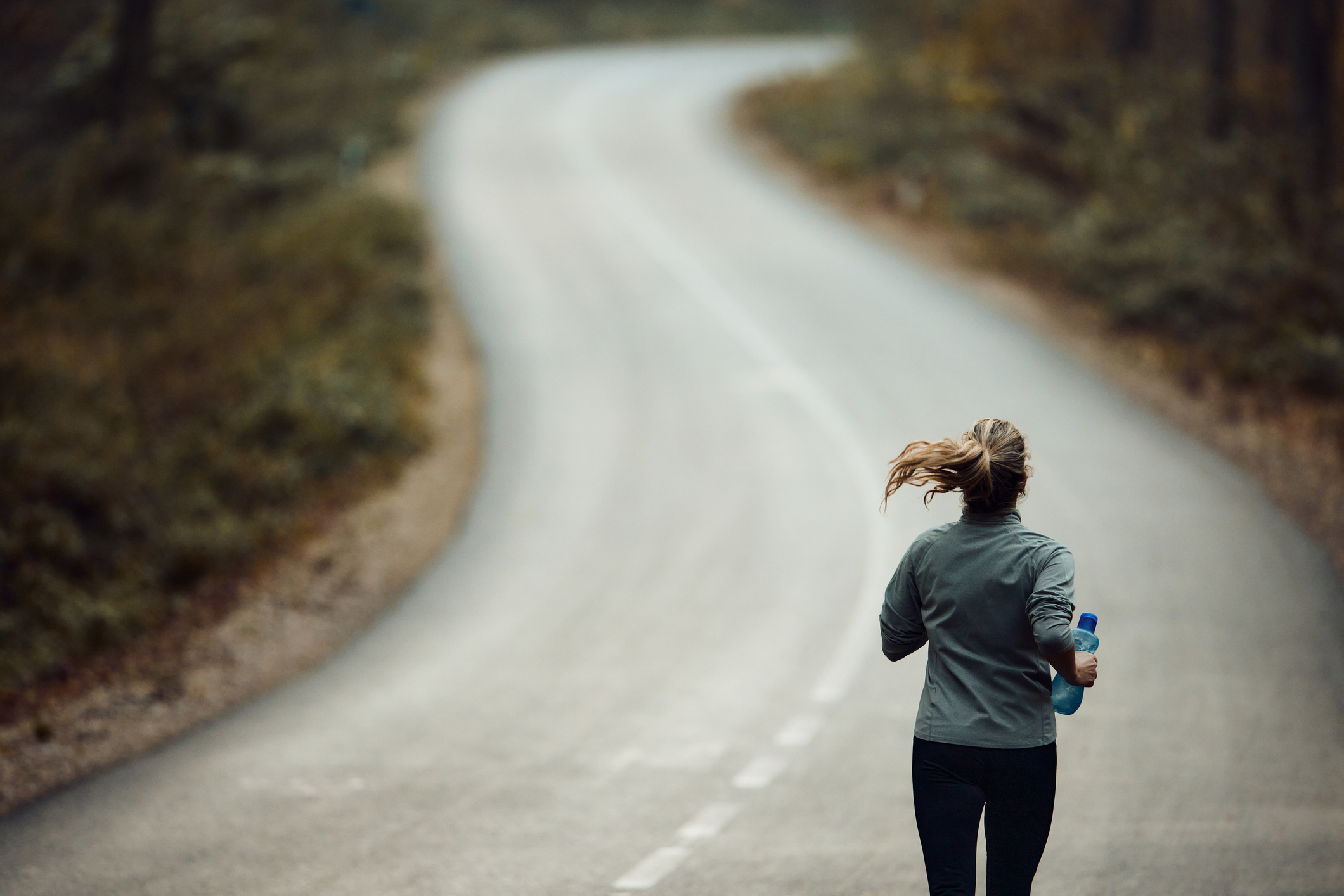 A woman running on a road