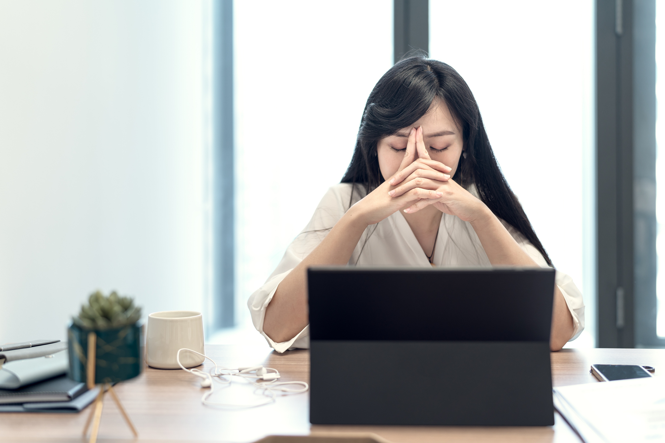 stressed woman at her desk