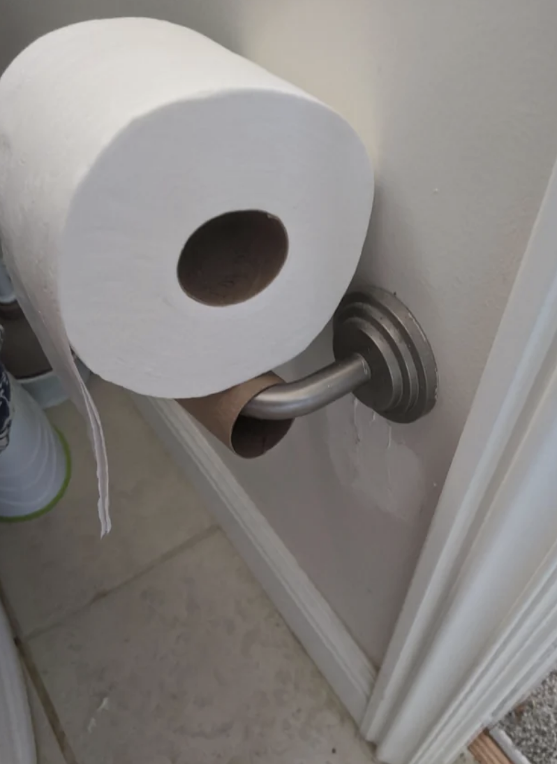 a toilet paper roll on top of a holder