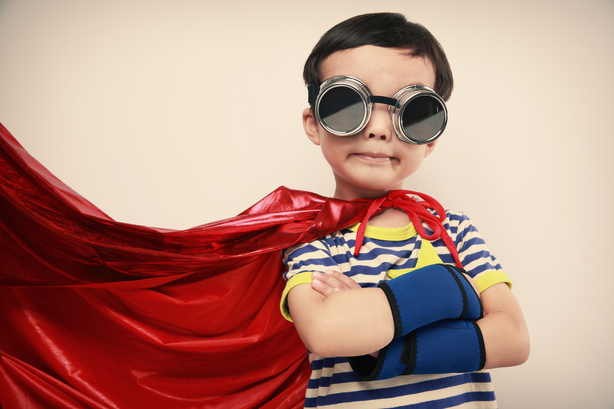 A little boy dressed as a superhero