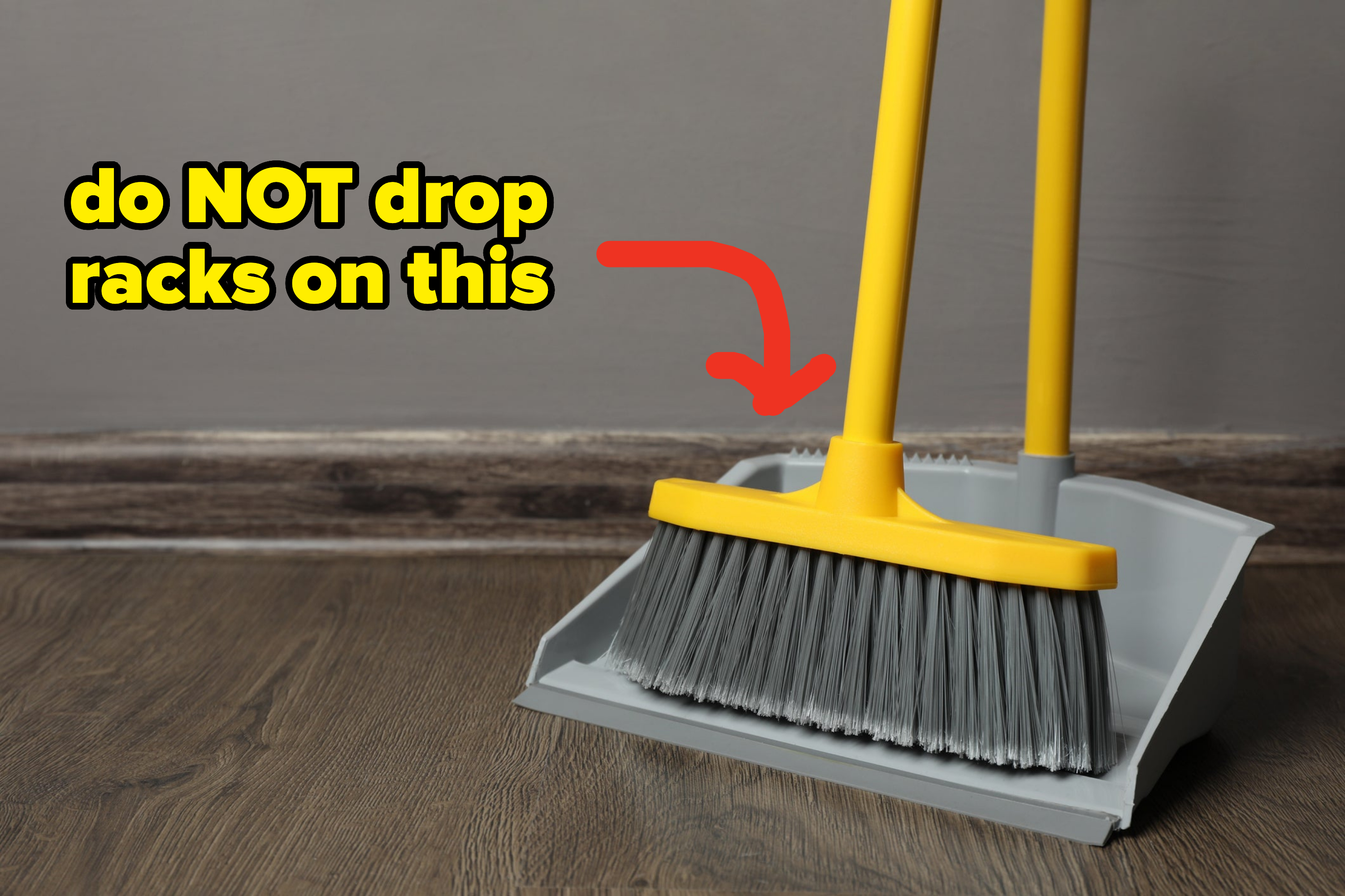 simple broom and pan with text, do not drop racks on this