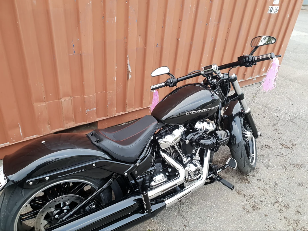a motorcycle with pink tassels