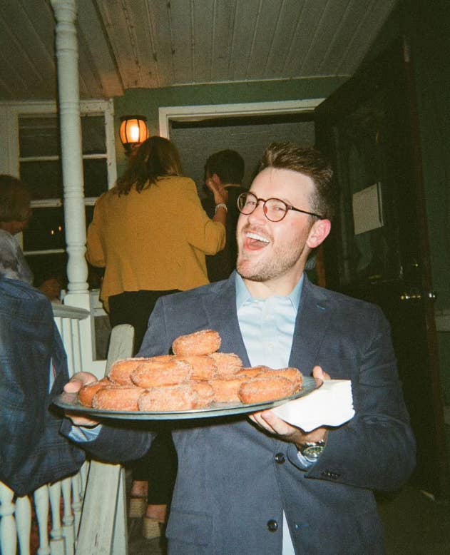 The author holding a very large platter of cider donuts