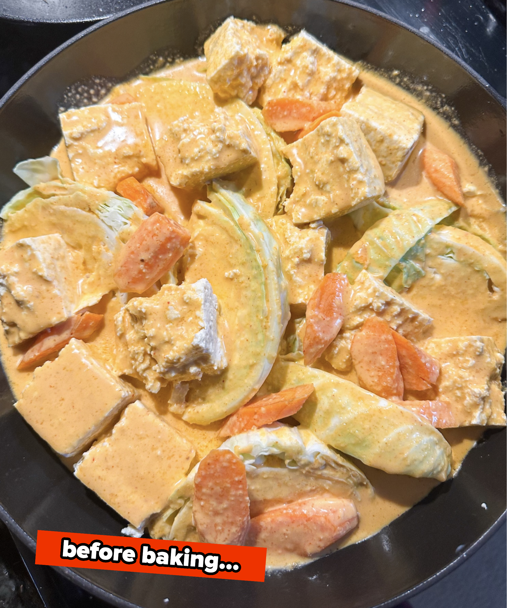 Cabbage tofu and carrots in a curry sauce before baking