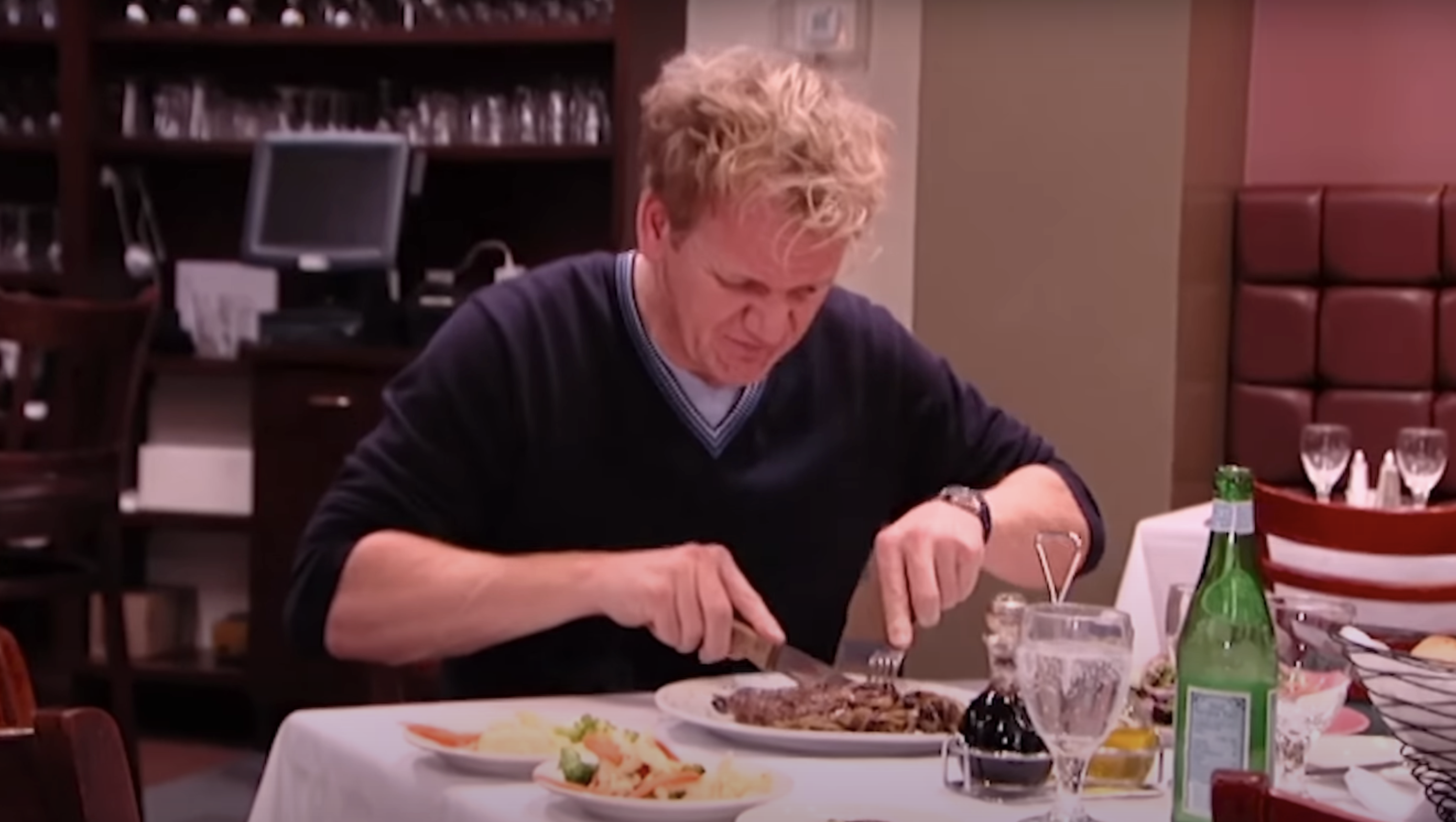 gordan ramsey trying out food in a restaurant